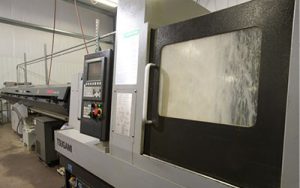 Precision Machining Technology - Tsugami B0385 w/bar feed Swiss Machine CNC Lathe