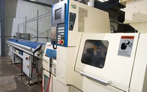 Precision Machining Technology - Tsugami BE20 w/bar feed Swiss Machine CNC Lathe